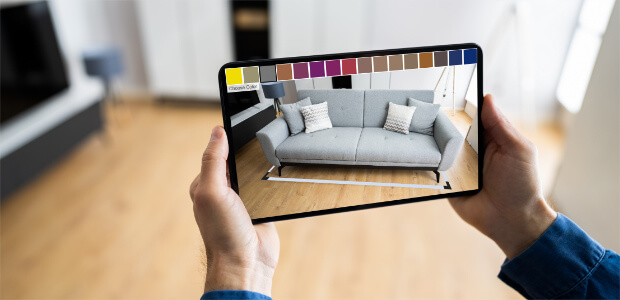 a man selecting couch color using augmented reality